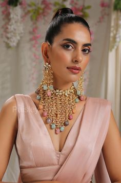 The Gold plated kundan necklace set is beautifully handcrafted by the artisans to represent the amalgamation of Indian craftsmanship and modern designs to bejewel your neckline. The multicolor natural stones added to the kundan necklace set celebrate the heritage of Indian jewelry. Embedded with high-grade kundan, the necklace set is an ode to the beautiful bride as she prepares to embark on her new chapter of life. Necklace Closure - Adjustable Dori Earrings Closure - Push Back Style Tip - Meet Festive Fusion Style Meenakari Bridal Necklace, Fusion Style Kundan Necklace With Meenakari For Reception, Fusion Kundan Necklace With Meenakari For Receptions, Festive Fusion Style Kundan Necklace With Meenakari, Fusion Style Bridal Necklace With Meenakari For Celebration, Fusion Style Kundan Bridal Necklace With Cutdana, Fusion Kundan Bridal Necklace With Cutdana, Fusion Style Kundan Bridal Necklace For Celebration, Fusion Style Bridal Necklace With Kundan And Cutdana