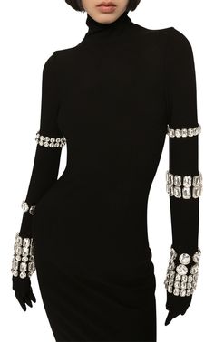 Dolce&Gabbana's collaboration with Kim Kardashian sees classic silhouettes receive an elevated refresh. This turtleneck midi dress is made from figure-hugging stretch-knit and embellished with crystal-studded bracelets along the exaggerated sleeves.Stretch-designRhinestone embellishmentHigh neckLong sleevesStraight hemClosure: zipped backComposition: Viscose 75%, Polyamide 17%, Spandex/Elastane 8%Embroidery: 30% brass, 70% glassMade in Italy Kim Kardashian Black Dress, Black Embellished Dress, Turtleneck Midi Dress, Exaggerated Sleeves, International Clothing, Dolce Gabbana Dress, Muslimah Fashion Outfits, Stylish Clothes For Women