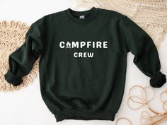 Campfire Crew Sweatshirt | Perfect sweatshirt for an outdoor lover - or the perfect gift for a hiker or camper! The perfect relaxed-fit pullover sweatshirt! This crewneck sweatshirt is made to order, and features a cotton and polyester blend that's soft to the touch and cozy on the inside.  COLORS This sweatshirt is available in in 8 different colors: - White - Black - Navy - Heather grey (dark grey) - Ash Grey (light grey) - Maroon - Forest Green - Sand SIZING - This is a loose-fit unisex sweatshirt available in sizes S-5XL, and fits true to size.  - For an oversized look I recommend sizing up 1-2 sizes.  - For more sizing measurements details see the size chart in the last photo. CARE INSTRUCTIONS - Machine wash cold (max 30C or 90F) - Tumble dry low heat - Do not iron - Do not dry clean Outdoor Crew Neck Sweatshirt With Ribbed Cuffs, Sporty Crew Neck Sweatshirt For Outdoor, Sporty Crew Neck Sweatshirt For Hiking, Fall Camping Crew Neck Sweatshirt, Fall Crew Neck Sweatshirt For Camping, Outdoor Crew Neck Sweatshirt With Letter Print, Outdoor Letter Print Sweatshirt Crew Neck, Crew Neck Sweatshirt For Fall Camping, Casual Crew Sweatshirt For Outdoor Activities