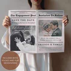 a woman holding up a newspaper with an image of a man and woman kissing on it