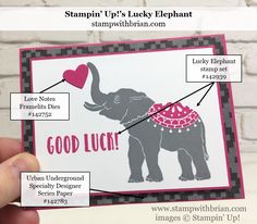 someone is holding up a card with an elephant on it and some words in the middle