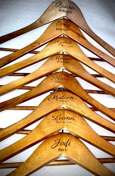 the wooden hangers have names on them