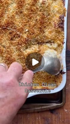 a person scooping food out of a casserole dish