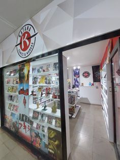 the inside of a comic store with comics on display