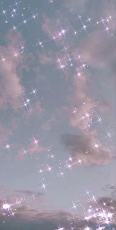 the sky is filled with stars and clouds