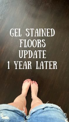 someone standing in front of a sign that says gel stained floors update 1 year later