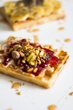 the waffles are topped with nuts and jelly