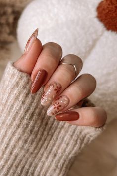 Fall nails, fall nail inspo, brown nails, fall floral nail art, September nails, almond shaped nails Cute Fall Almond Acrylic Nails, Heart Fall Nails, Thanksgiving Nails Leaves, Simple Thanks Giving Nails, Gel Thanksgiving Nails, November Nails Medium Length, Fall Nail Almond Designs, Fall Nails Pink And Brown, Brown And White Fall Nails