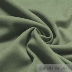 a close up view of a green fabric