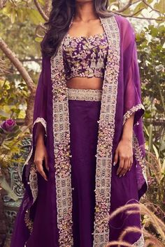 Shop for Prisho Purple Organza African Placket Embroidered Cape And Skirt Set for Women Online at Aza Fashions Eid Cape Sleeves Choli With Intricate Embroidery, Embroidered Sets With Cape Sleeves For Reception, Eid Choli With Intricate Embroidery And Cape Sleeves, Embellished Sets With Cape Sleeves For Festivals, Festive Sets With Intricate Embroidery And Cape Sleeves, Traditional Sharara With Floral Embroidery And Cape Sleeves, Festive Sharara With Floral Embroidery And Cape Sleeves, Embroidered Blouse Piece With Cape Sleeves For Wedding, Eid Lehenga With Cape Sleeves And Intricate Embroidery