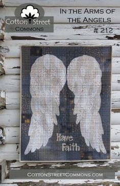 two white angel wings with the words, in the arms of the angels and have faith