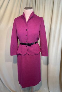 "This is a cute, vintage, 2 piece matching skirt set from early late 70s or early 80s but made in 40s style. No labels, but it does have a Union label & a care & content label. It is a skirt and a matching jacket in bubby textured polyester in raspberry purple. Tagged a size 12. Waist measures 28 to 34\", bust measures 34\", please see measurements below. The jacket has mid length sleeves & a slightly funnel neckline. It buttons up the front with 4 plastic buttons & the buttonhol Retro Fitted Skirt Suit, Retro Fitted Skirt Suit For Spring, Vintage Fitted Long Sleeve Skirt Suit, Vintage Fitted Skirt Suit With Long Sleeves, Fitted Vintage Skirt Suit With Long Sleeves, Retro Fitted Long Sleeve Skirt Suit, Vintage Fitted Skirt Suit For Fall, Retro Fitted Winter Skirt Suit, Retro Winter Fitted Skirt Suit