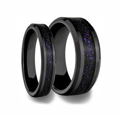 two black ceramic rings with purple glitter inlays