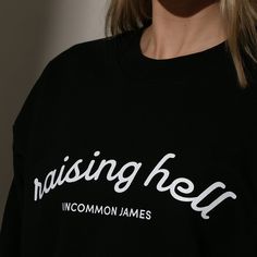 Show off your wild side with our Raising Hell Sweatshirt. Coming in black, this crewneck sweatshirt is just what you need to make sure everyone knows you’re a little bit of a wild card. For a full look, pair your sweatshirt with our Raising Hell Trucker Hat. Want more Uncommon James sweatshirts? Shop our full apparel line. Uncommon James, Streetwear Ideas, Wild Card, Full Look, Re A, Everyone Knows, Crewneck Sweatshirt, Womens Tees, Apparel Accessories