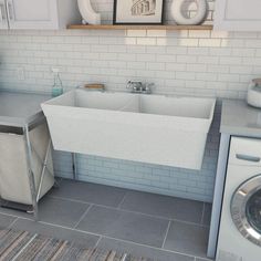 a kitchen with a sink, dishwasher and washing machine