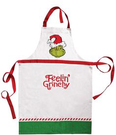 an apron with the words feelin'griney on it and a santa hat