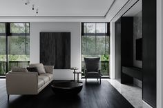 a modern living room with black and white decor