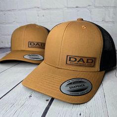 Custom Dad Patch Established "ANY YEAR" or up to two years for multiple children. We make our patches in Branson Missouri U.S.A. and take a great deal of pride in our products. You will love this hat! ORDERING: Select your hat color and enter the ESTABLISHED YEAR(s) up to two years Example 2020-2023 for Dad's with more than one child. The patch will be made with the year(s) you enter so please be accurate.  Yupoong Premium 6 Panel Trucker Snapback Hat: Hat Color: Various Color Options Fabric: Cotton-Poly/Nylon Mesh Size: Adjustable Snapback One Size Fits Most Washing instructions; Hand wash cold only, wipe dirty areas only with a damp cloth, do not submerse hat in water, do not wet the patch area at all. Do not machine wash, Do not wash in a dishwasher or the hat may become damaged.  NO RE Customizable Curved Brim Trucker Hat For Father's Day, Customizable Hats As Father's Day Gifts, Dad Pregnancy Announcement, Dad Birthday Gifts, Branson Missouri, Pregnancy Announcement Gifts, Branson Mo, Multiplication For Kids, Personalized Gifts For Dad