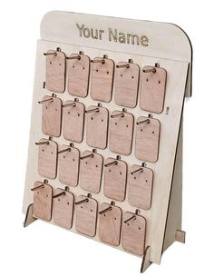 a wooden calendar is shown with wood tags attached to the front and back of it