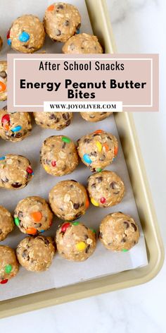 after school snacks energy peanut butter bites on a baking sheet with text overlay that reads after school snacks energy peanut butter bites