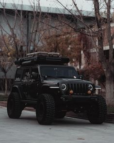 the jeep is parked on the side of the road