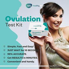 a woman in a gold dress holding up an ovulation test kit