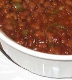 a white bowl filled with chili and beans