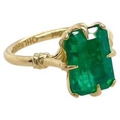 Glamorously bold and unabashedly seductive. This showstopper ring features a glorious claw set Emerald, embraced by small golden ropes and a one of a kind stone set within a petal basket. •Available in 18ct Yellow, White & Rose gold •Ethically sourced emerald cut Emerald Every OHLIGUER jewel is custom made to order and requires six to eight weeks production time. Please contact our customer service team after purchase to discuss your size and track the production of your piece. engagement or sol Antique Cushion Cut Diamond, Reef Knot, Antique Cushion Cut, Emerald Cut Engagement Ring, Antique Cushion, Contemporary Engagement Rings, Emerald Cut Engagement, Gold For Sale, Modern Engagement Rings