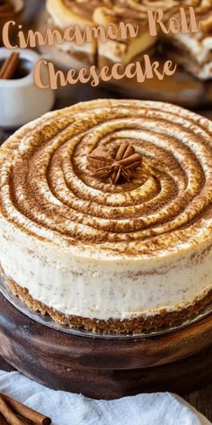 cinnamon roll cheesecake on a plate with cinnamon sticks