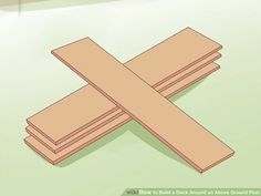 three pieces of wood sitting next to each other on top of a green tablecloth