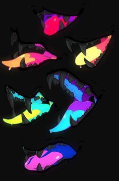 four different colored fish swimming in the dark