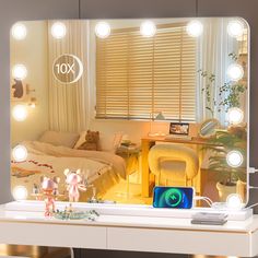 a vanity mirror with lights on it and an image of a bed in the background