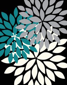 a black and white flower with teal leaves