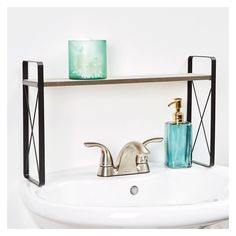 a bathroom sink with a soap dispenser and toothbrush holder on it