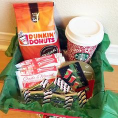 a basket filled with coffee and snacks sitting on top of a wooden floor next to a wall