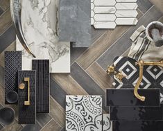 an assortment of black and white tile with gold accents