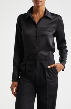 This picture-of-polish shirt is crafted from luxe satin with covered buttons at the front, back and cuffs. Front button closure Spread collar Long sleeves with three-button cuffs 100% polyester Dry clean Made in Turkey Elegant Semi-formal Shirt With Covered Buttons, Sleek Fitted Blouse With Buttons, Classic Black Satin Top, Elegant Long Sleeve Shirt With Back Button Closure, Elegant Silk Shirt For Formal Occasions, Classic Silk Top For Night Out, Sleek Fitted Shirt With Buttons, Sleek Fitted Shirt With Button Closure, Classic Satin Tops For Evening