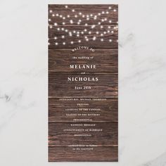 the rustic wood and string lights wedding program