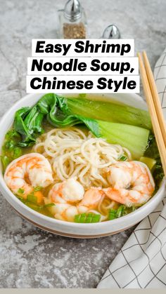 a bowl of shrimp noodle soup with chopsticks next to it on a marble surface