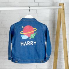 How adorable are these Space themed Personalised Denim Jackets for Babies and Young Children? Starting at 3-6 months through to 4-5 years, this personalised denim jacket is super cute and will match any outfit. A super soft denim jacket personalised with their name and a space inspired motif. Any child will look cool in this personalised denim jacket. This would make a perfect birthday gift for a little Boy. We also think this would make a really cool new baby gift. Hand-printed with love and ca Customizable Blue Denim Jacket, Customizable Long Sleeve Denim Jacket, Customizable Denim Jacket, Blue Cotton Denim Jacket For Playtime, Customizable Blue Denim Jacket With Long Sleeves, Playful Cotton Denim Jacket With Pockets, Long Sleeve Denim Jacket For Playtime, Playful Blue Cotton Denim Jacket, Playful Long Sleeve Cotton Denim Jacket