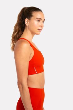 Our ALRN Crop Bra is made from post consumer waste products ( including fishing nets and carpets) and is sustainably produced in a method that significantly reduces water usage. This fabric offers excellent compression, coupled with stretch and breathability for the perfect amount of support without constriction. A clean finish neckline, armhole and under-bust ensures maximum comfort, even on your longest runs. Compressive Lightweight Nylon Activewear, Lightweight Compressive Nylon Activewear, Orange Activewear With Medium Support For Gym, Orange Activewear For Gym With Medium Support, Compressive Lightweight Solid Activewear, Functional Orange Activewear For Gym, Orange Functional Running Activewear, Lightweight Micro-elastic Athleisure Activewear, Lightweight Fitted Nylon Activewear