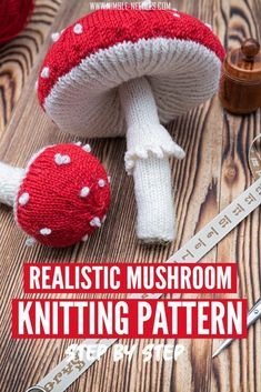 a knitted mushroom sitting on top of a wooden table next to a measuring tape