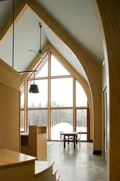 the interior of a house with large windows