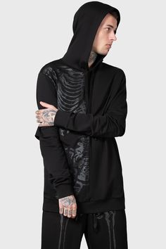 BAD2THE.- Soft, light stretch cotton.- Statement, black-on-black print.- XL hood with drawstring.- Long, cuffed sleeves.- Fitted.- Unisex, so it's for everyone.Model with blonde hair is 5ft 4 and wears a size L for a relaxed fit.Model with neck tattoos is 6ft 1 and wears a size L.with KILLSTAR branding, 100% Cotton. Killstar Dress, 2010 Fashion, Neck Tattoos, Gothic Gifts, Black Lips, Alternative Outfits, Neck Tattoo, Soft Light, Cuff Sleeves