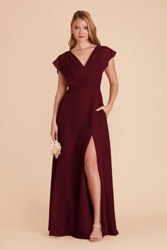 a bridesmaid in a long dress with a slited skirt and side slit