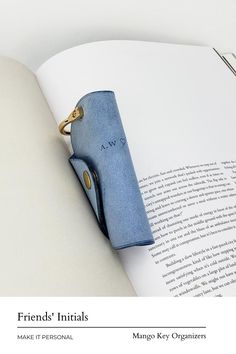 an open book with a blue case on it's cover and the words friends initials