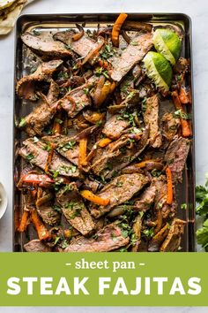 steak fajitas on a sheet pan with lettuce and carrots