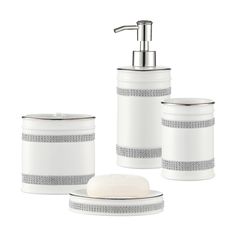 three pieces of white bathroom accessories including soap dispenser and toothbrush holder