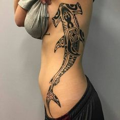 a woman with a tattoo on her stomach