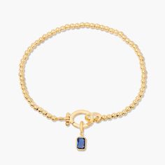 Treat your wrists to some bling with the Mackenzie Birthstone Bracelet. With a vivid birthstone charm, and intricately-beaded gold, this sparkling accessory is sure to add a touch of glam to any outfit. Avery Bracelet: Available in 14k gold plated or rhodium plated brass, 6" bead bracelet, hinge closure measures 1/2", 4mm beads Mackenzie Hinge Birthstone Charm: Available in 14k gold plated sterling silver or rhodium plated sterling silver1/8"x1/4" charm, 5mm Cubic Zirconia NOTE - open bracelet h Gold-plated Yellow Gold Bracelets With Birthstone, 14k Gold-filled Yellow Gold Bracelets With Birthstone, Adjustable Gold-tone Charm Bracelet, Elegant Gold-tone Chain Charm Bracelet, Elegant 14k Gold-tone Charm Bracelet, Open Bracelet, Slide Bracelet, Modern Jewellery Design, Birthstone Colors